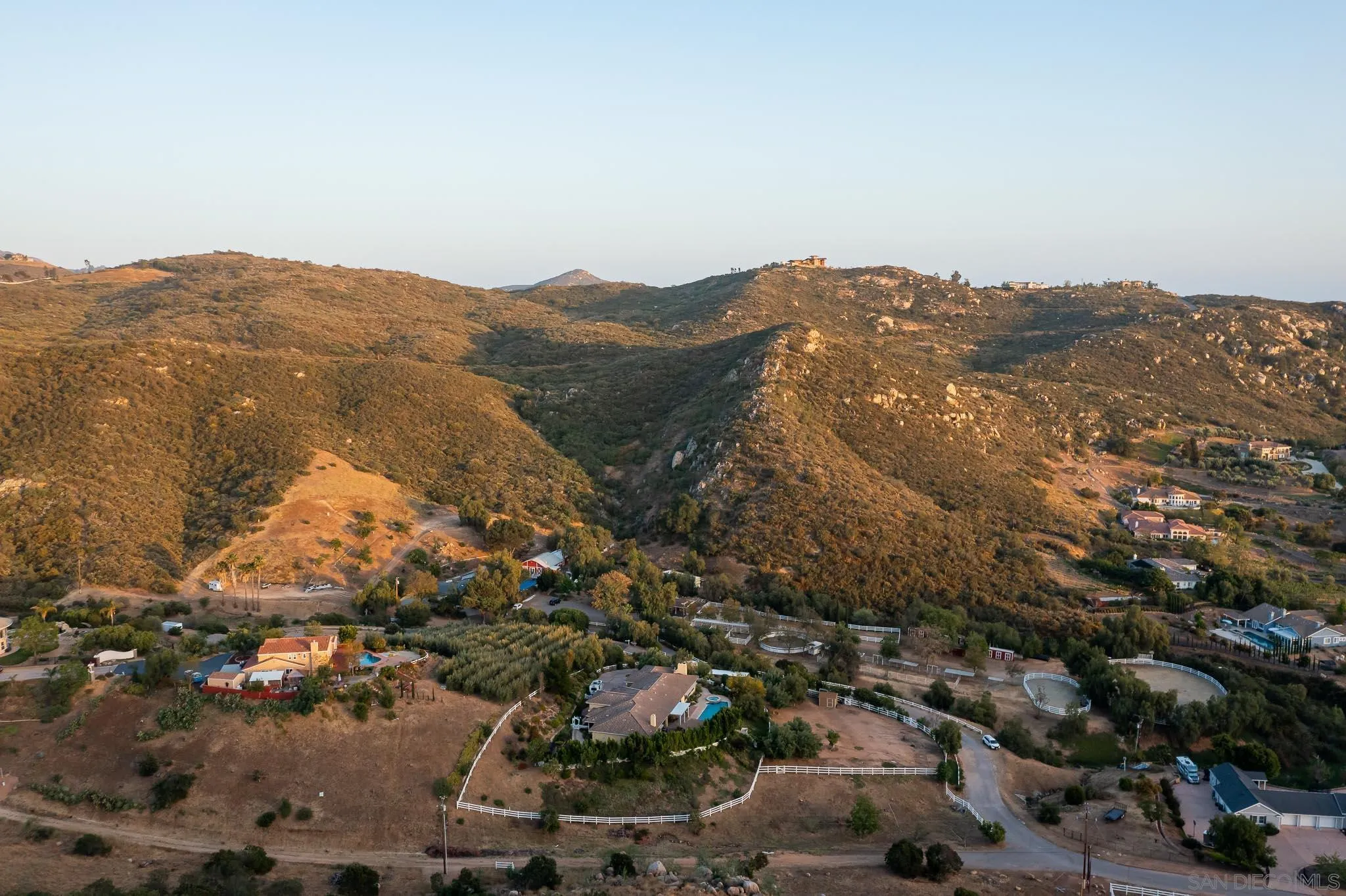 15435 Eastvale Road Poway, CA 92064 - Photo 57 of 57 an aerial view of residential house and mountains in the background