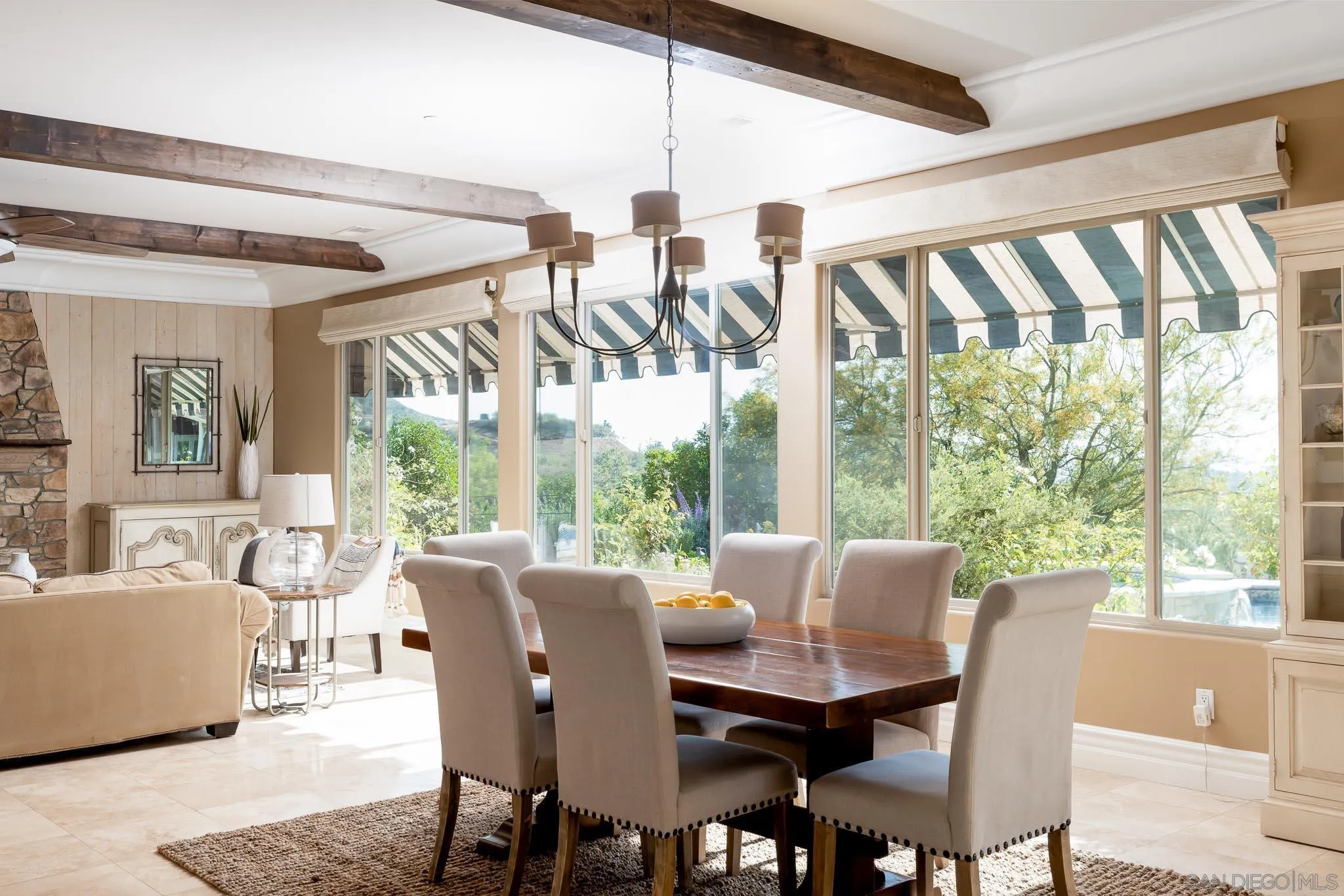 15435 Eastvale Road Poway, CA 92064 - Photo 8 of 57 a view of a dining room with furniture a chandelier and wooden floor