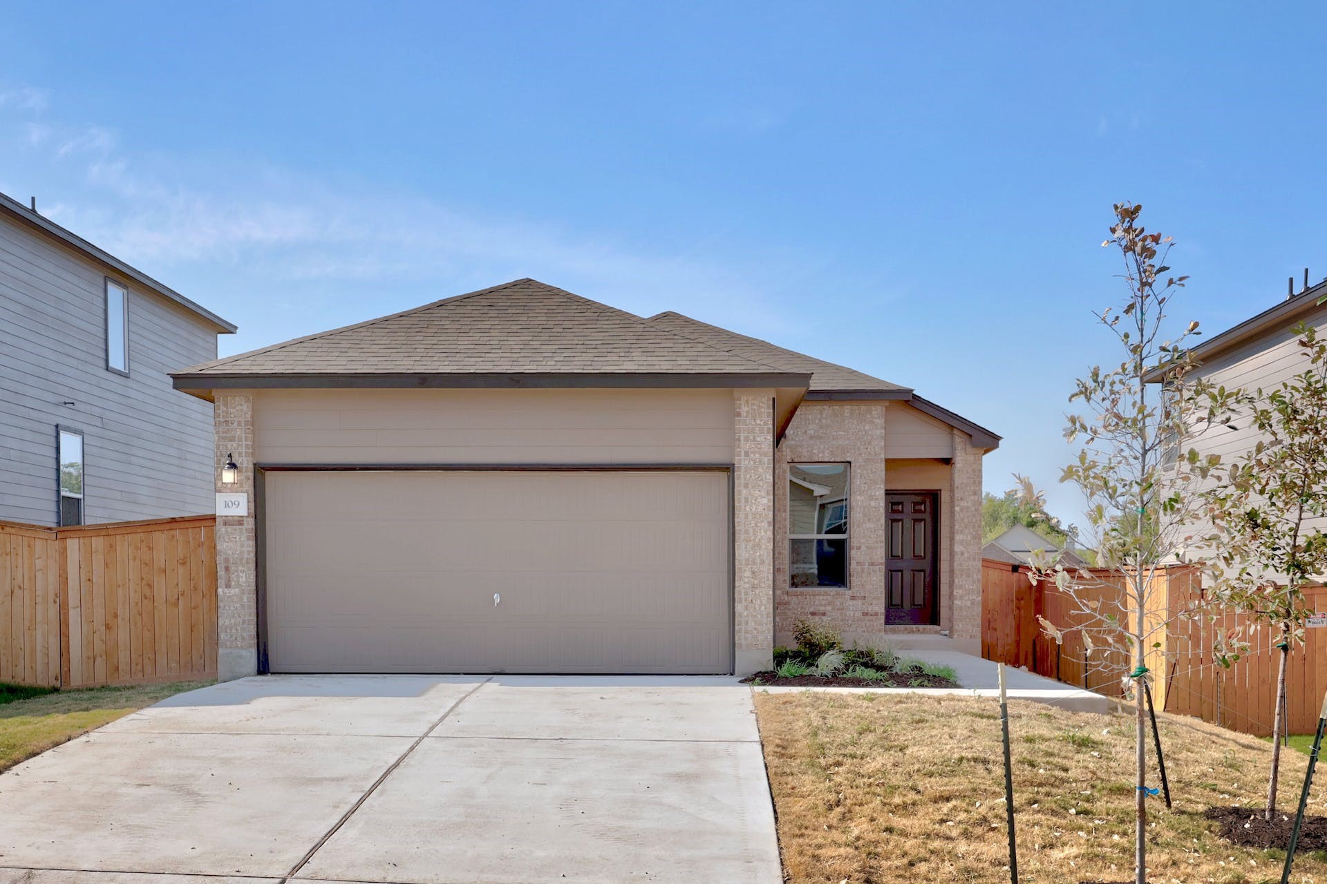 a front view of a house with garden