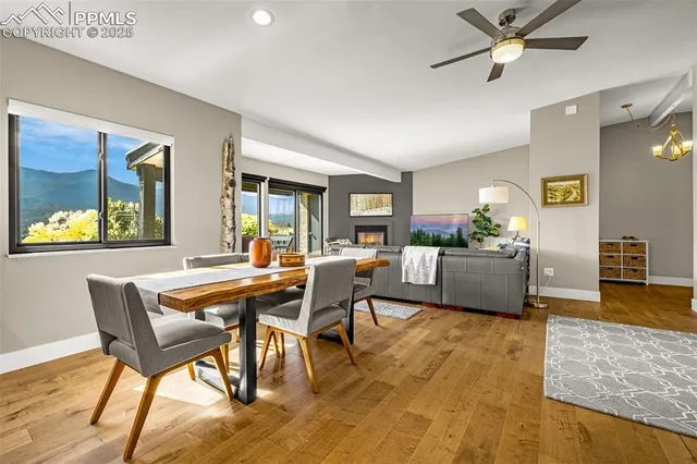 a view of a dining room with furniture and a wooden floor