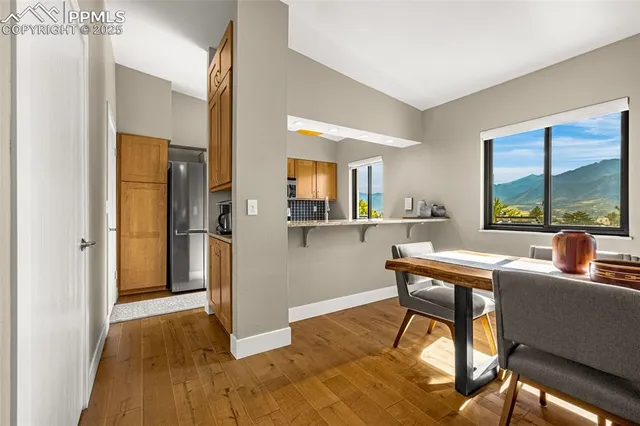 a workspace with wooden floor and a window