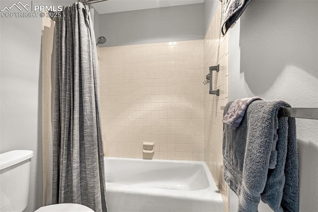 1130 Fontmore Road, Unit D Colorado Springs, CO 80904 - Photo 20 of 33 a bathroom with a tub and a shower