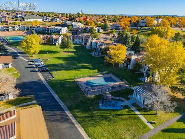 an aerial view of a house with a garden house