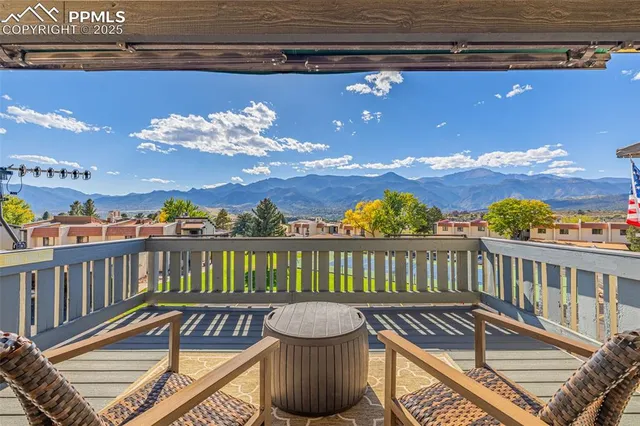 a view of a balcony with wooden floor