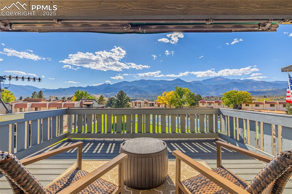 1130 Fontmore Road, Unit D Colorado Springs, CO 80904 - Photo 3 of 33 a view of a balcony with wooden floor