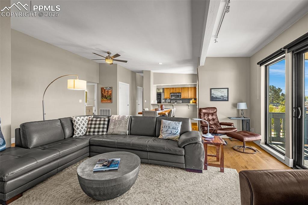 1130 Fontmore Road, Unit D Colorado Springs, CO 80904 - Photo 9 of 33 a living room with furniture and a large window