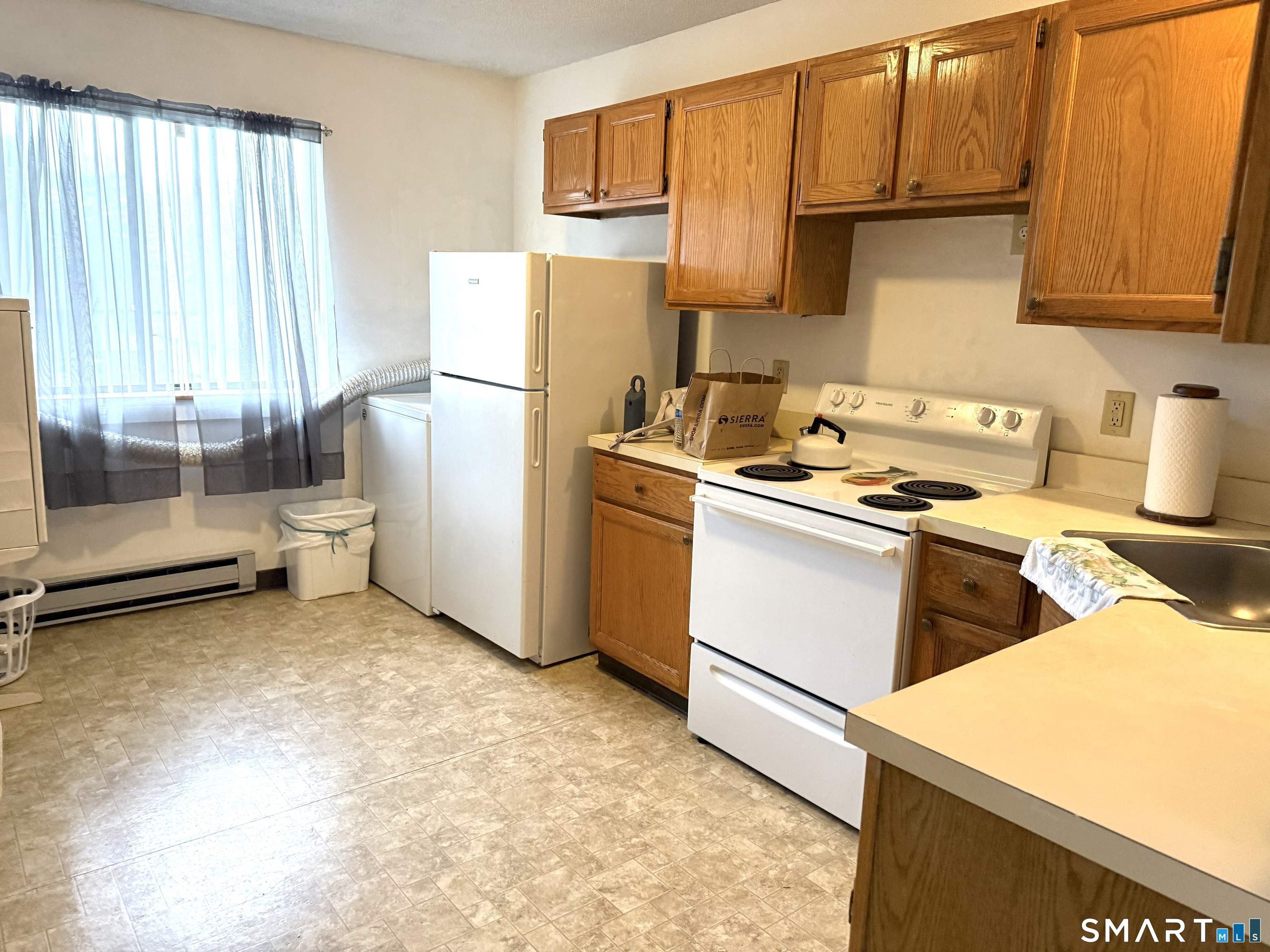 264 Scott Road, Unit 4 Waterbury, CT 06705 - Photo 4 of 13 Eat in kitchen with washer and dryer.
