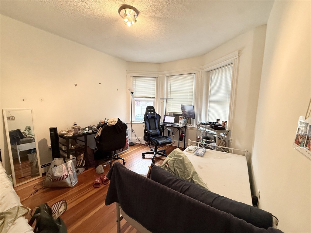 8 Wave Avenue, Unit 1 Boston, MA 02125 - Photo 3 of 10 a living room with furniture