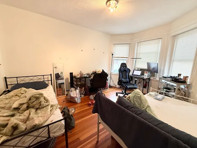 a workspace with furniture and wooden floor