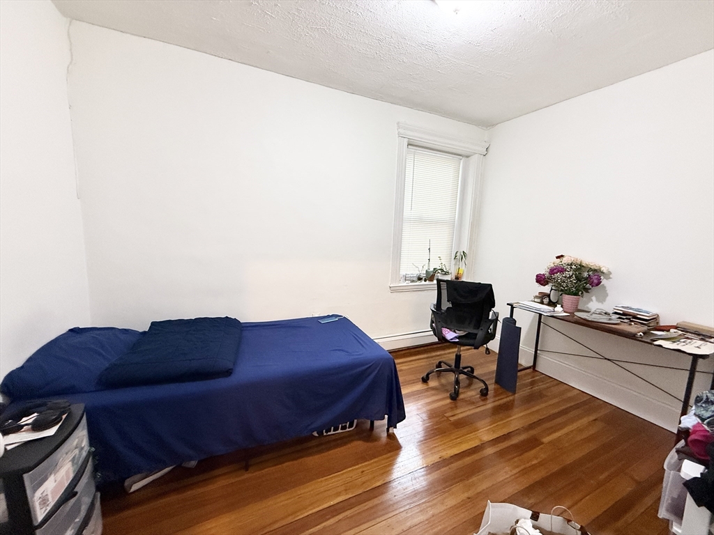 8 Wave Avenue, Unit 1 Boston, MA 02125 - Photo 5 of 10 a workspace with furniture and wooden floor