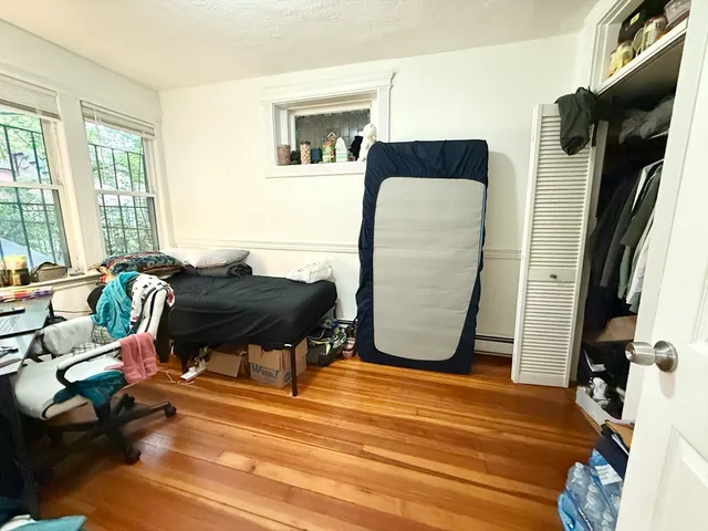 a bathroom with a sink mirror and toilet