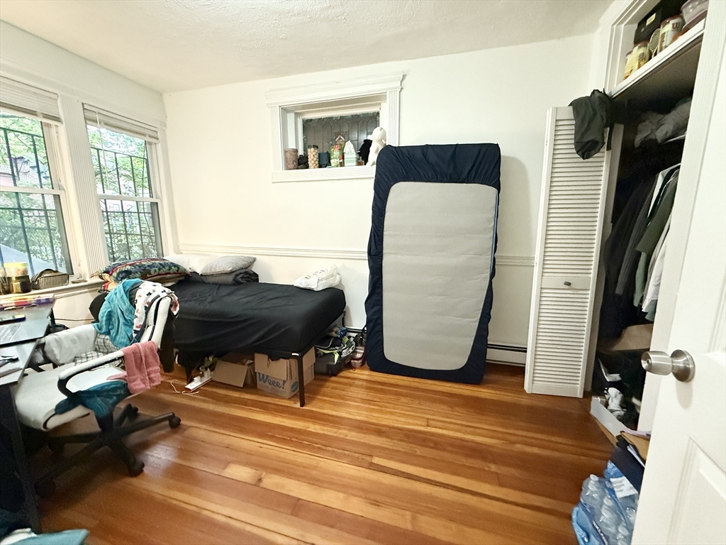 8 Wave Avenue, Unit 1 Boston, MA 02125 - Photo 7 of 10 a workspace room with furniture and wooden floor