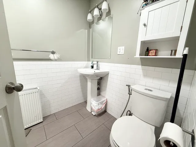 a bathroom with a shower and a toilet