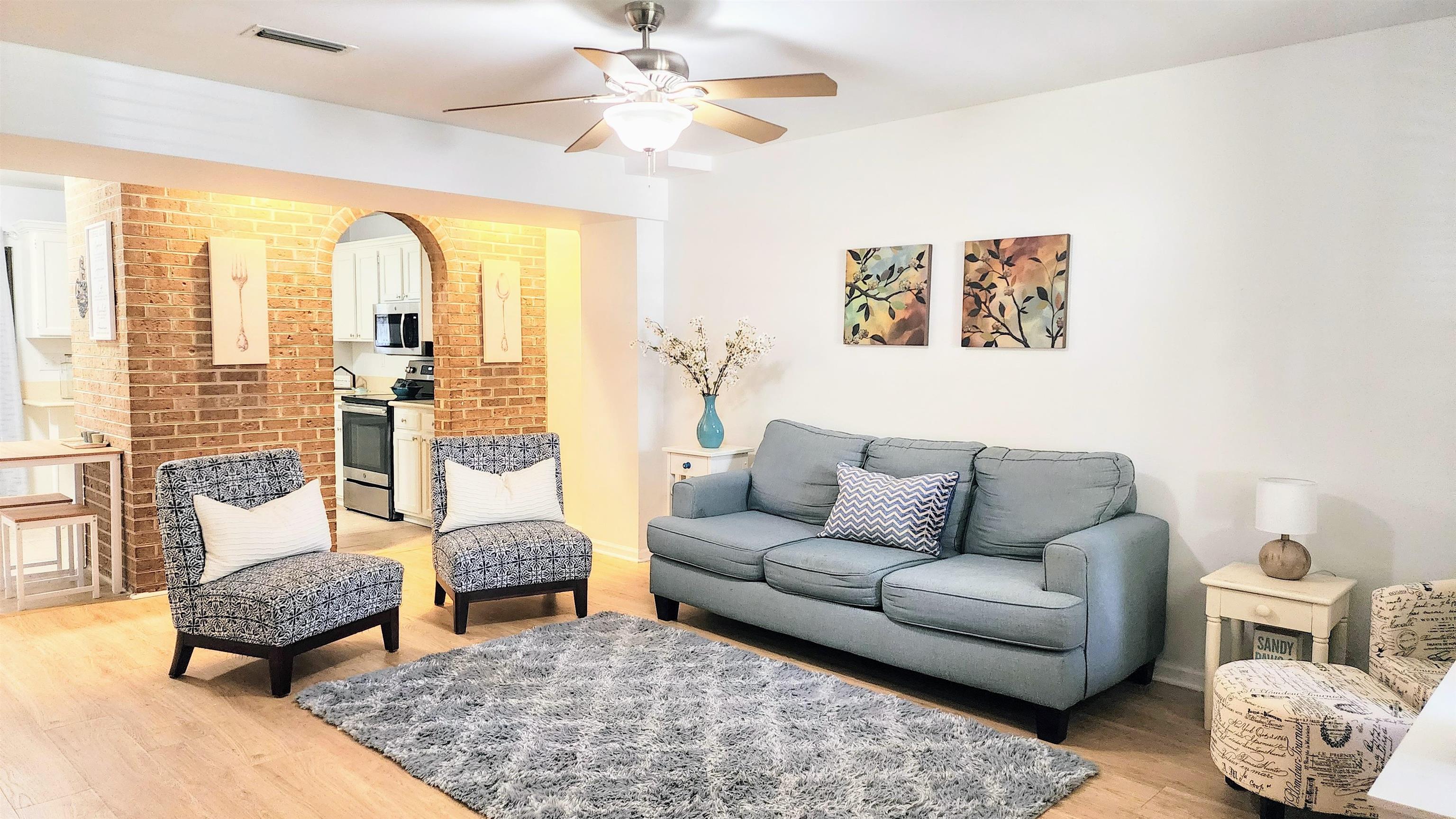 616 Bowers Lane St. Augustine, FL 32080 - Photo 1 of 18 a living room with furniture and a large window