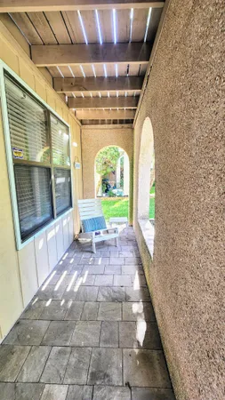 a view of a balcony and wooden floor