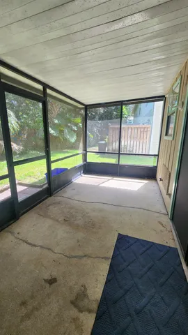 a view of a swimming pool and trees in the background