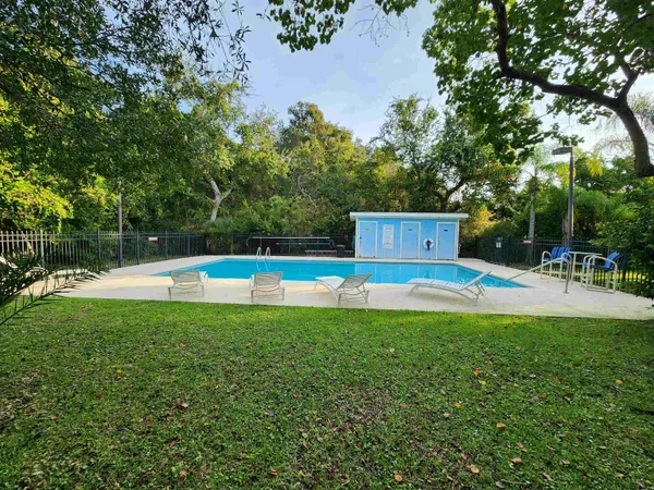 a view of a swimming pool with a patio