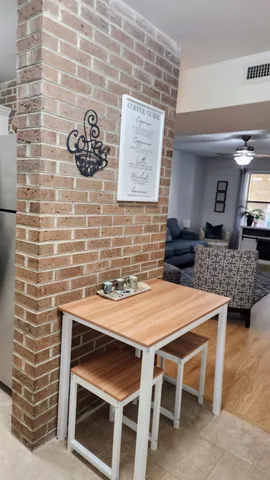 a table and chairs in front of a door