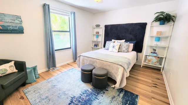 a bedroom with bed and a window