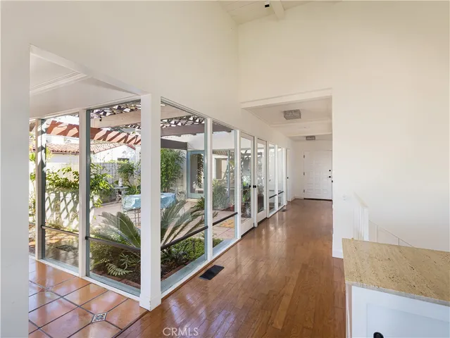 a view of an entryway with wooden floor