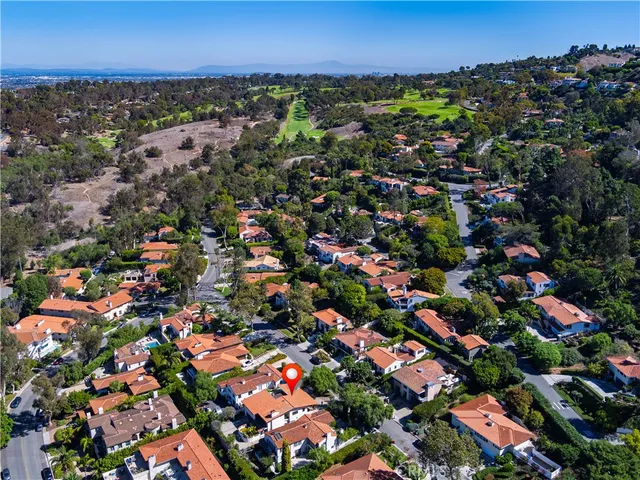 an aerial view of residential building and ocean