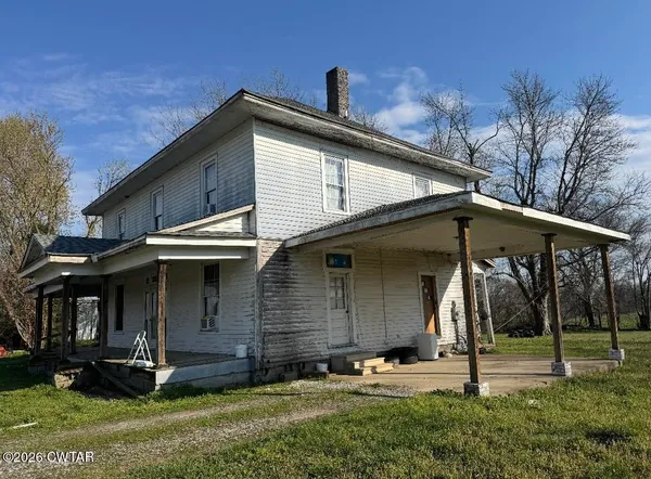 a view of house with yard
