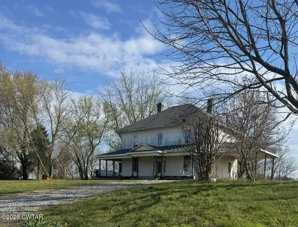 a view of house with yard