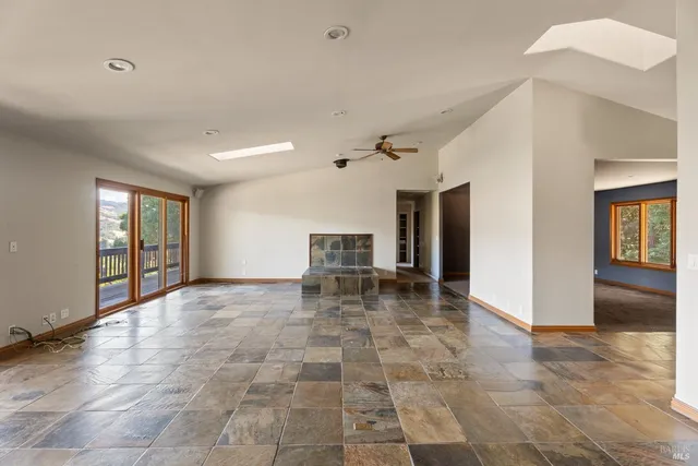 a view of livingroom with workspace and hallway
