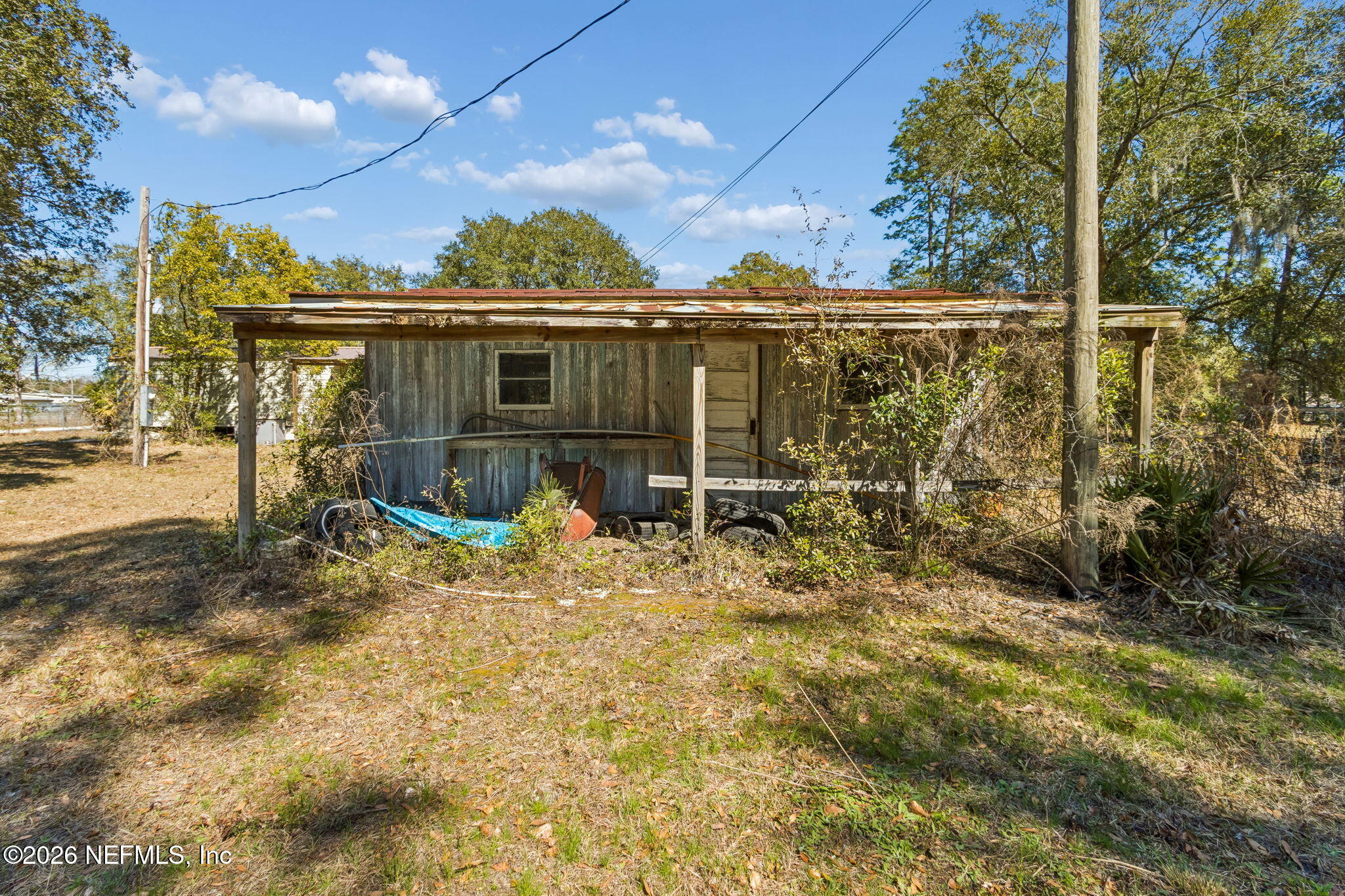 86341 Goodbread Road Yulee, FL 32097 - Photo 24 of 27 a view of a chair and table in the patio