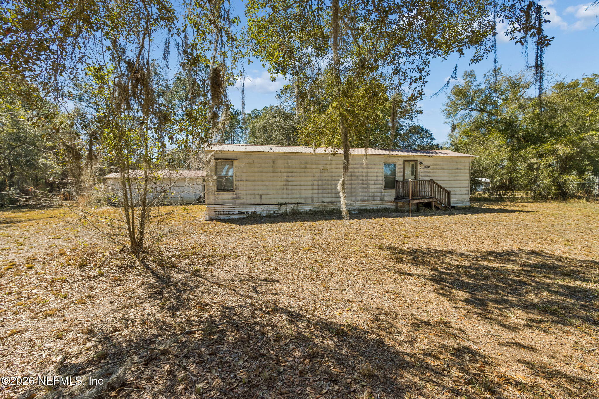 86341 Goodbread Road Yulee, FL 32097 - Photo 3 of 27 a view of a backyard of the house