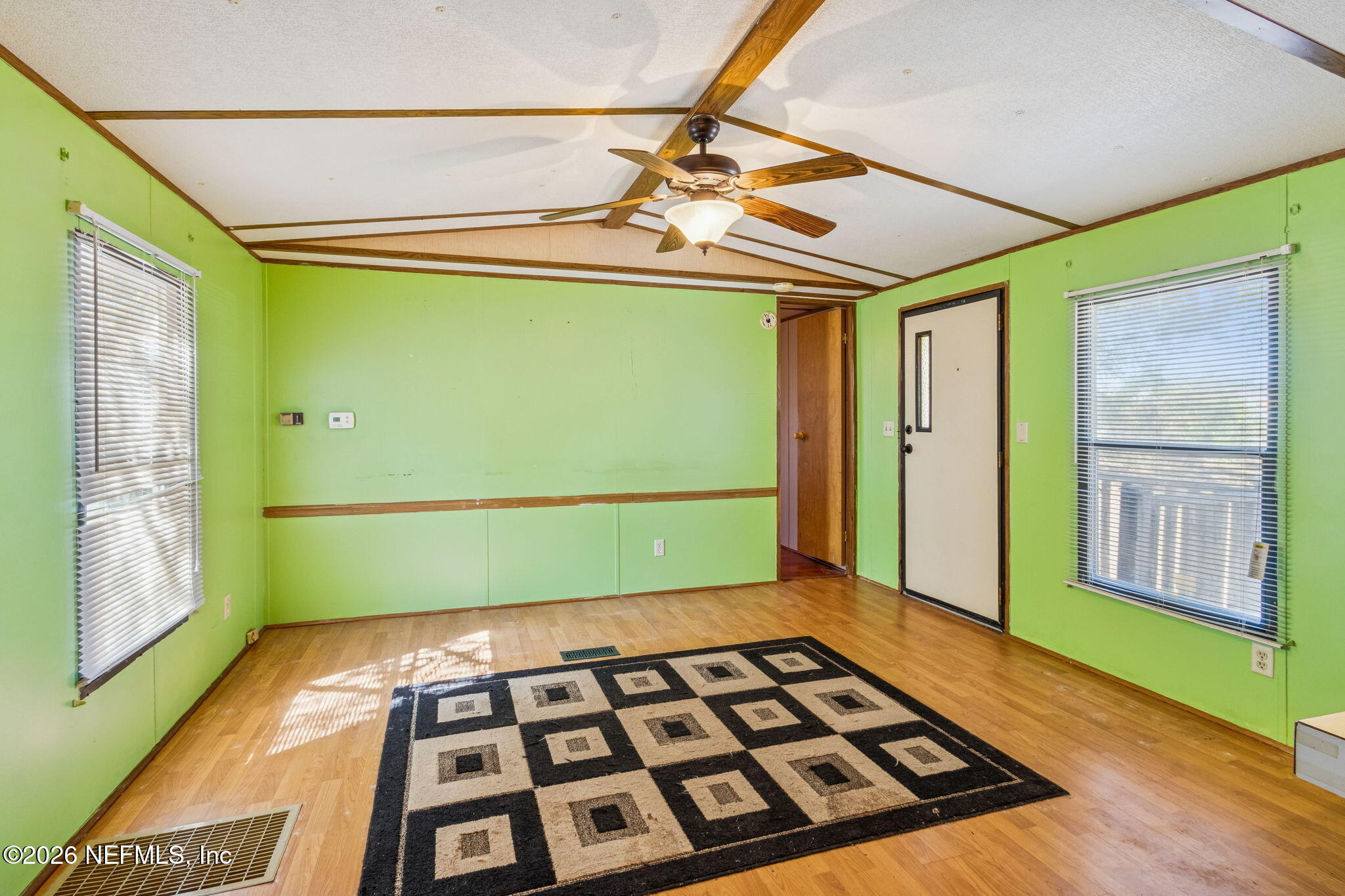 86341 Goodbread Road Yulee, FL 32097 - Photo 6 of 27 a view of a room with window and wooden floor