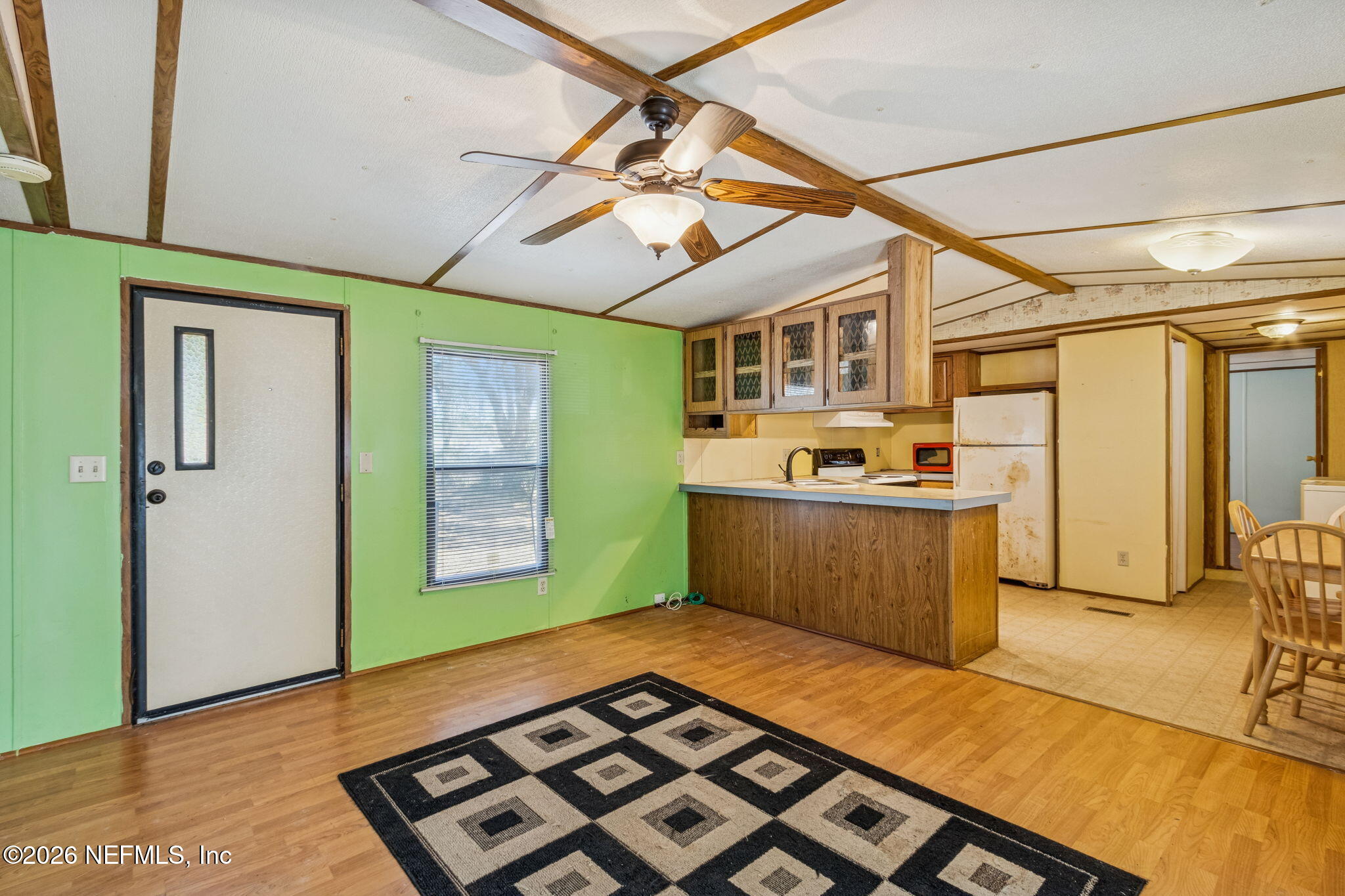 86341 Goodbread Road Yulee, FL 32097 - Photo 7 of 27 a kitchen with stainless steel appliances granite countertop a sink and cabinets
