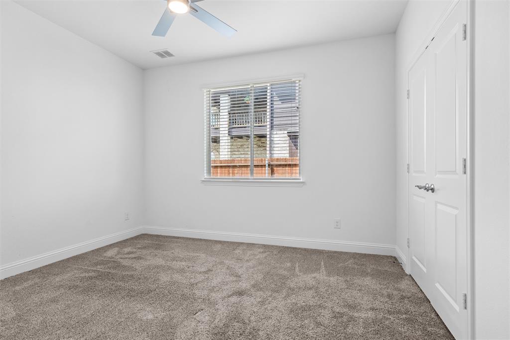 753 Truchas Avenue Forney, TX 75126 - Photo 17 of 29 an empty room with a window and a ceiling fan