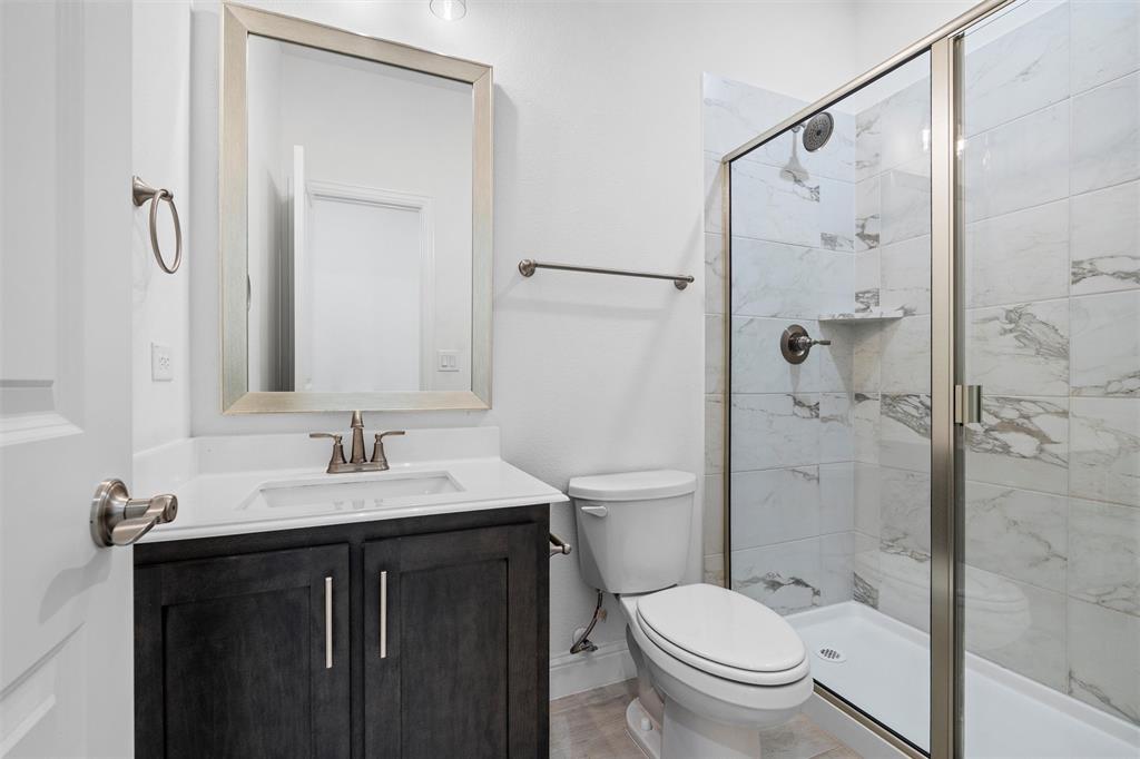 753 Truchas Avenue Forney, TX 75126 - Photo 18 of 29 a bathroom with a sink toilet and shower