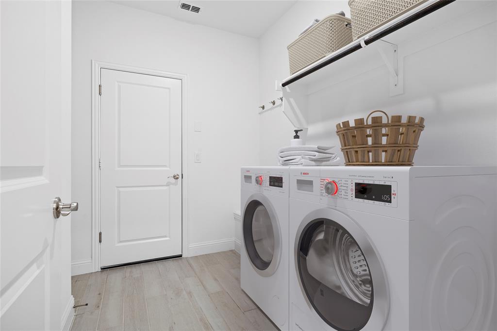 753 Truchas Avenue Forney, TX 75126 - Photo 20 of 29 a utility room with dryer and washer