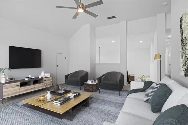 a living room with furniture and a flat screen tv