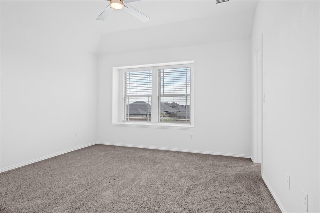 753 Truchas Avenue Forney, TX 75126 - Photo 26 of 29 an empty room with windows and fan
