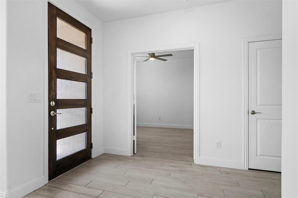 753 Truchas Avenue Forney, TX 75126 - Photo 3 of 29 a view of an empty room with closet and cabinet