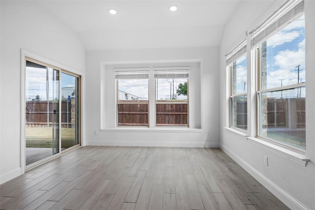 753 Truchas Avenue Forney, TX 75126 - Photo 8 of 29 a view of an empty room with wooden floor and a window