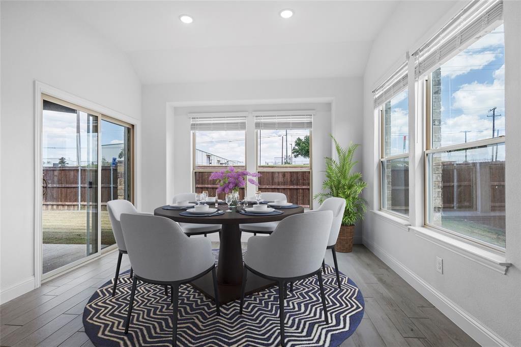 753 Truchas Avenue Forney, TX 75126 - Photo 9 of 29 a dining room with furniture a chandelier and wooden floor