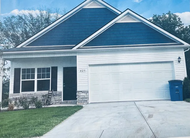 a house view with a garden space