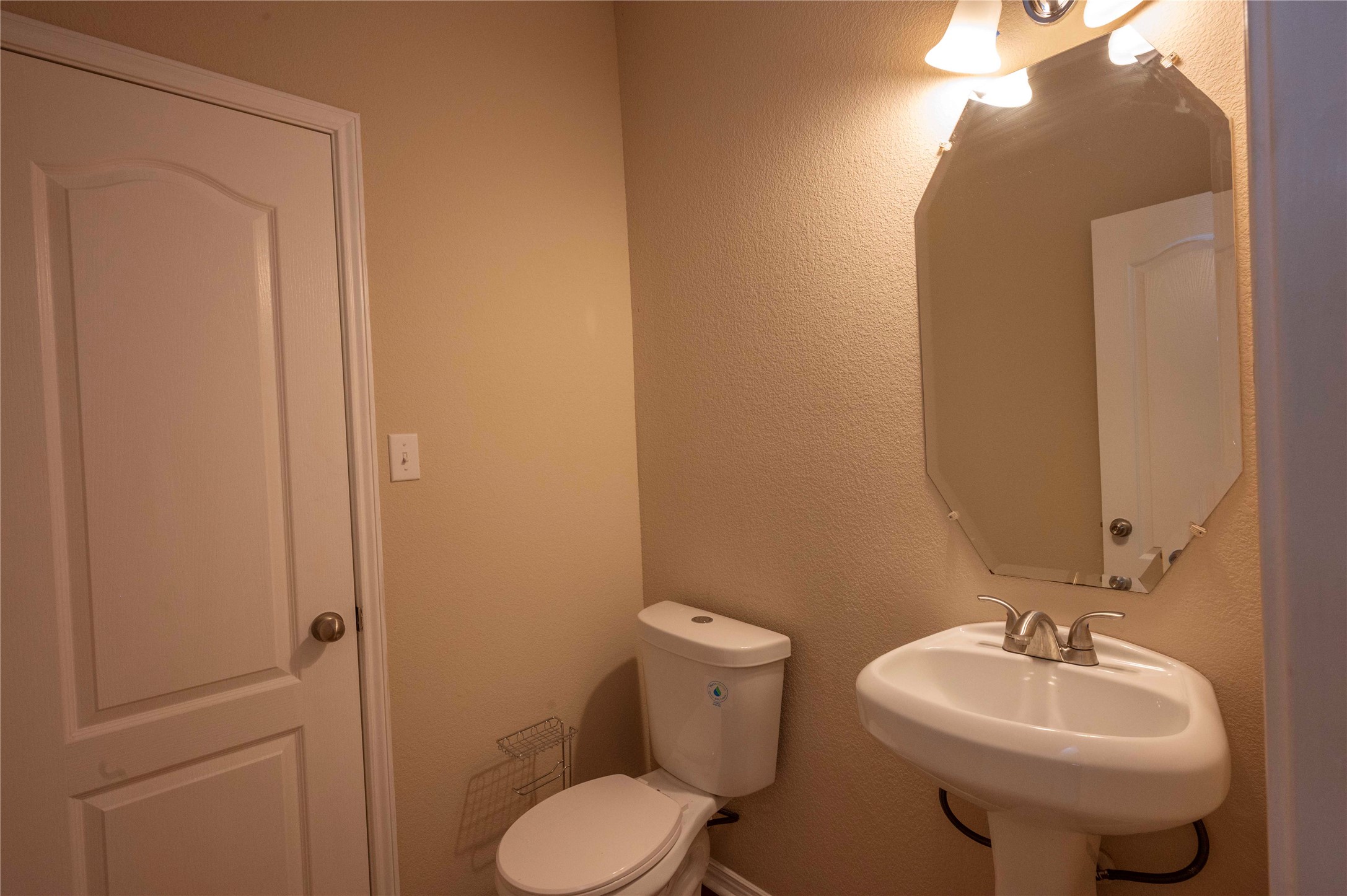 2070 Intrepid Drive Buda, TX 78610 - Photo 17 of 31 A well-appointed lavatory featuring essential fixtures and a contemporary mirror.