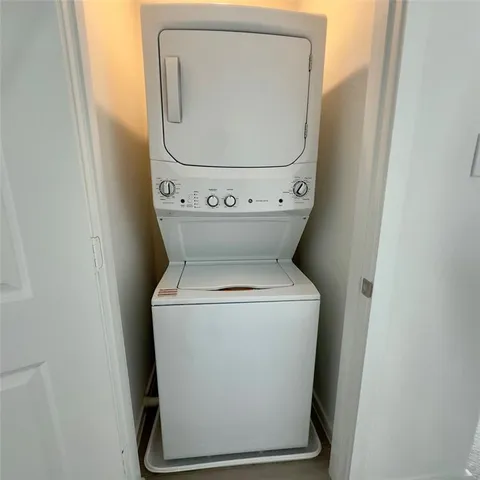 a bathroom with a toilet sink a mirror and shower