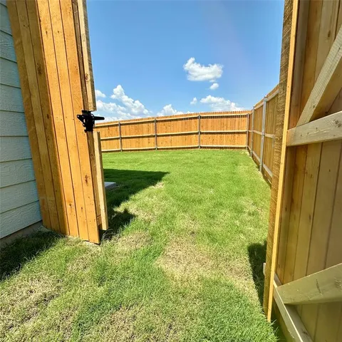 a view of a backyard of the house