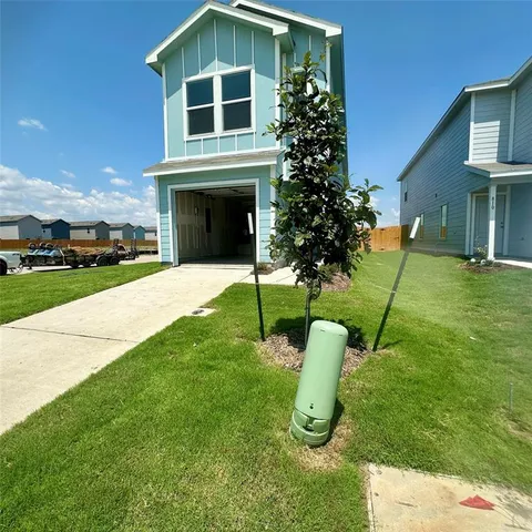 a house with garden in front of it