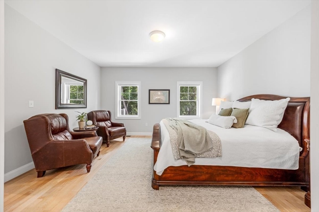 14 Longwood Lane, Unit 14 Hanover, MA 02339 - Photo 13 of 42 a bedroom with a bed couch and window