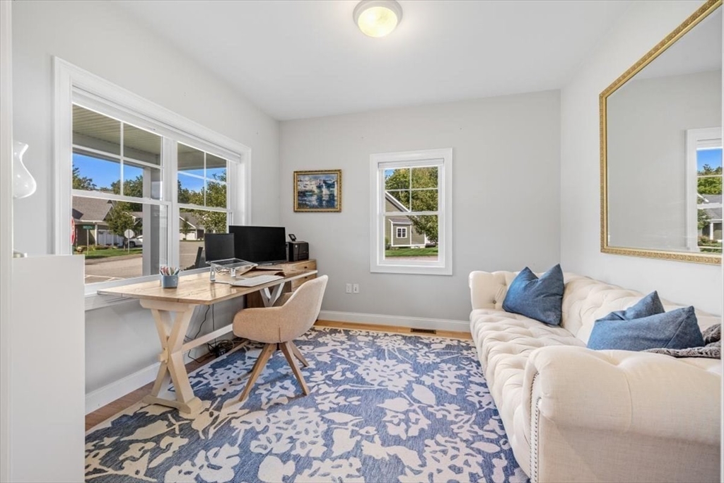 14 Longwood Lane, Unit 14 Hanover, MA 02339 - Photo 15 of 42 a living room with furniture wooden floor and a window