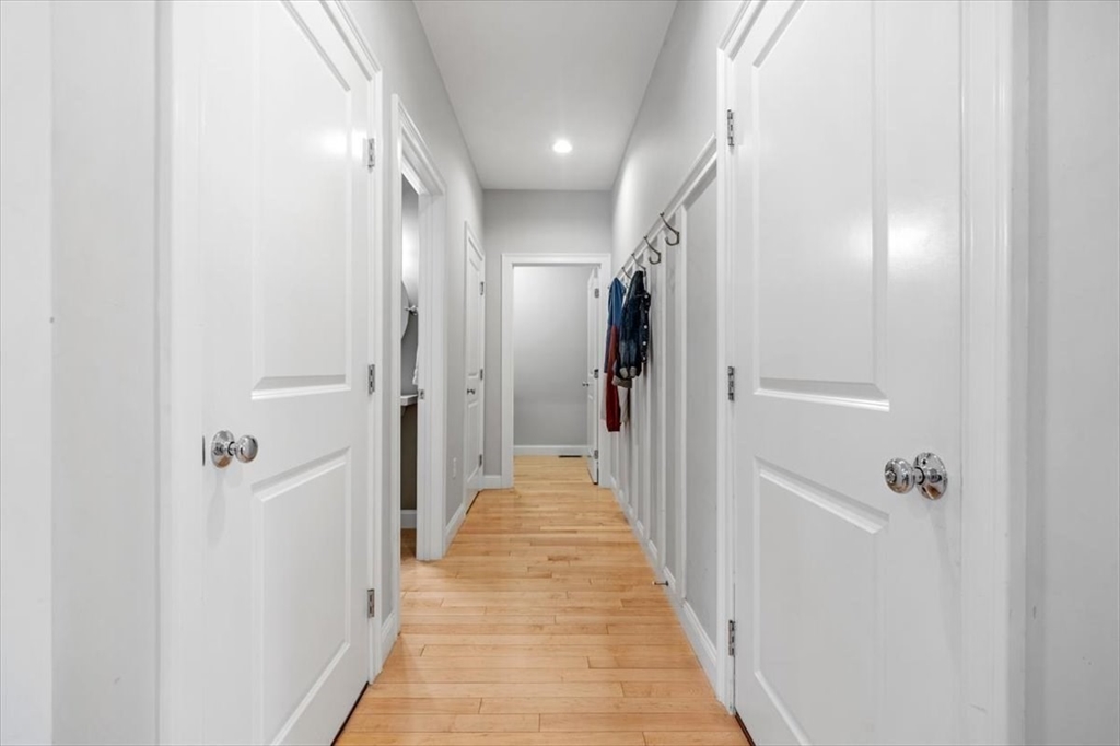 14 Longwood Lane, Unit 14 Hanover, MA 02339 - Photo 16 of 42 a view of a hallway with a white walls