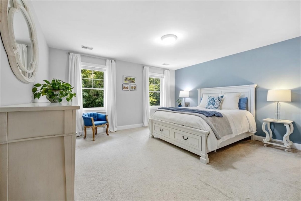 14 Longwood Lane, Unit 14 Hanover, MA 02339 - Photo 21 of 42 a bedroom with a bed and a large window