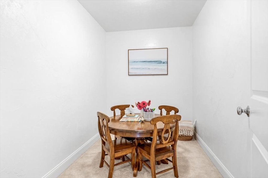 14 Longwood Lane, Unit 14 Hanover, MA 02339 - Photo 23 of 42 a view of a dining room with furniture and wooden floor